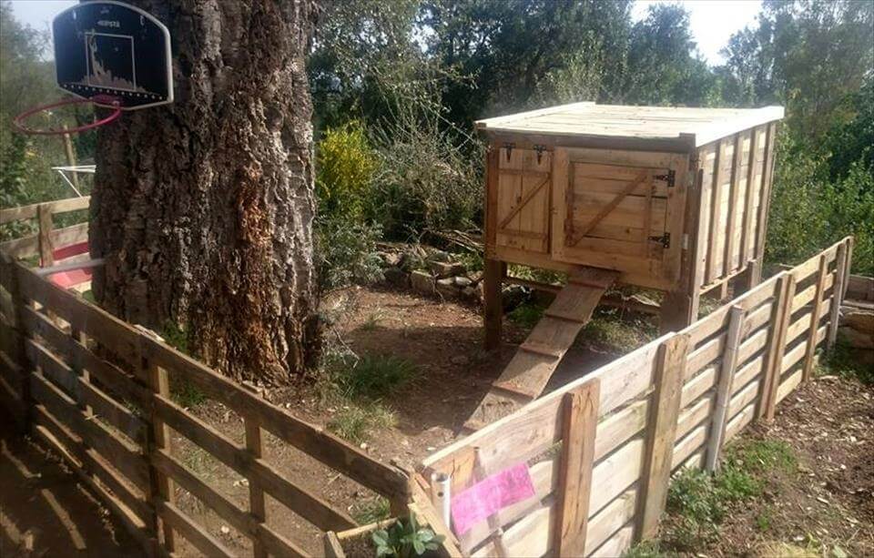 diy pallet chicken coop with wooden fence