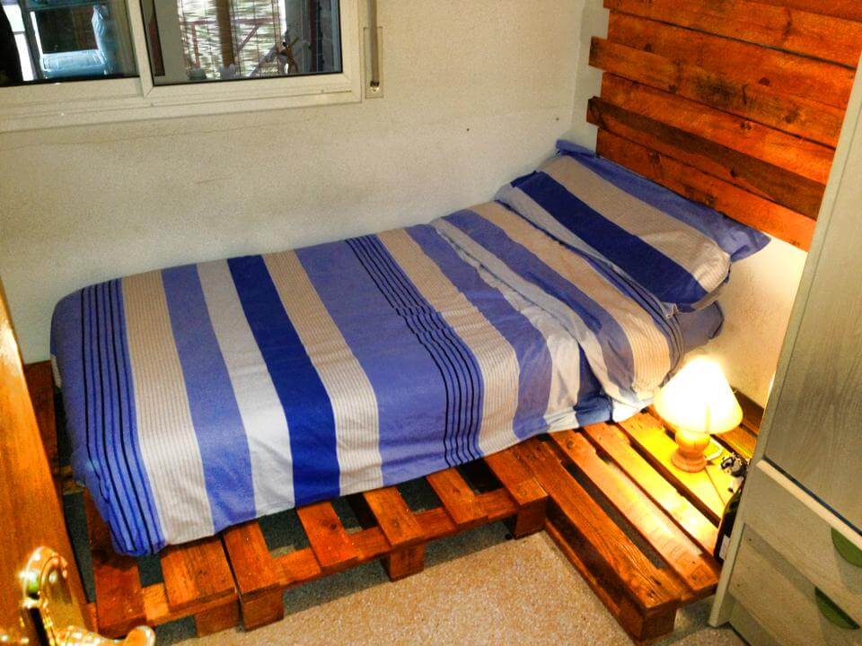 wooden pallet bed with nightstand and headboard wall